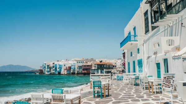 white and brown concrete buildings near sea during daytime