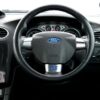 Interior view of a Ford Focus RS, showcasing the steering wheel and dashboard details.