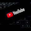 YouTube logo displayed on a backlit keyboard, representing digital media and online content creation.