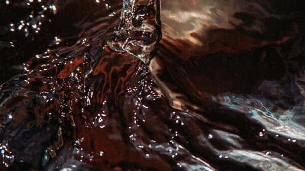 Captivating close-up of water splashing with dynamic motion, showcasing vibrant reflections and fluid textures.