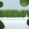 3D render of the word 'ENERGY' covered in grass, symbolizing green energy and sustainability.