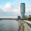 A stunning view of Belgrade Tower by the Danube River at dusk in Serbia.