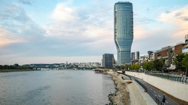 A stunning view of Belgrade Tower by the Danube River at dusk in Serbia.