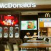 McDonald's fast food restaurant featuring self-service kiosks and digital menus.