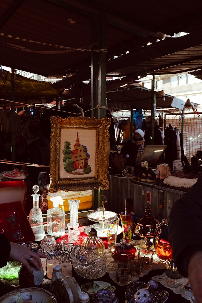 A man standing in front of a table filled with dishes