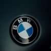 Detailed image of the iconic BMW logo displayed on a car hood.