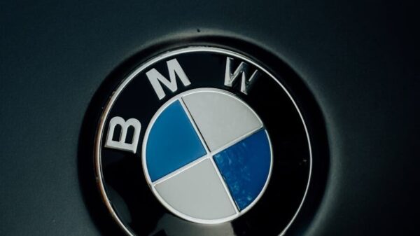 Detailed image of the iconic BMW logo displayed on a car hood.