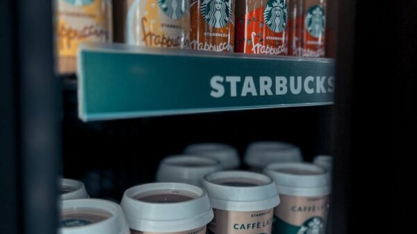 Assorted Starbucks drinks displayed in a cooler, featuring coffee and frappuccino bottles.