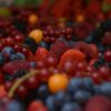 bunch of raspberry and grapes