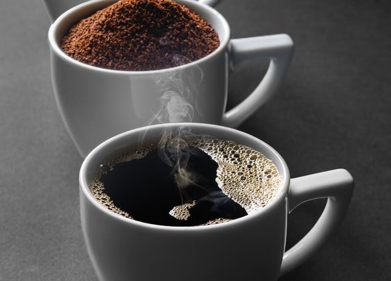 A journey of coffee from beans to a fresh brew in three cups, highlighting the stages of preparation.