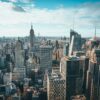 Stunning aerial view of New York City skyline featuring the iconic Empire State Building and skyscrapers.