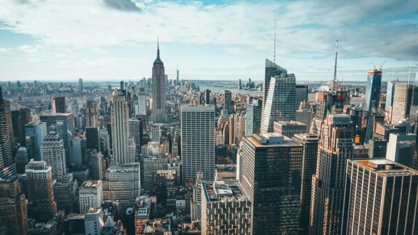 Stunning aerial view of New York City skyline featuring the iconic Empire State Building and skyscrapers.