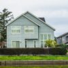 A contemporary detached house in a suburban neighborhood with a scenic canal front.
