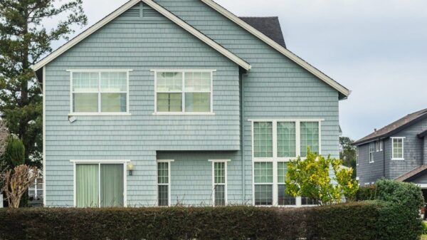 A contemporary detached house in a suburban neighborhood with a scenic canal front.