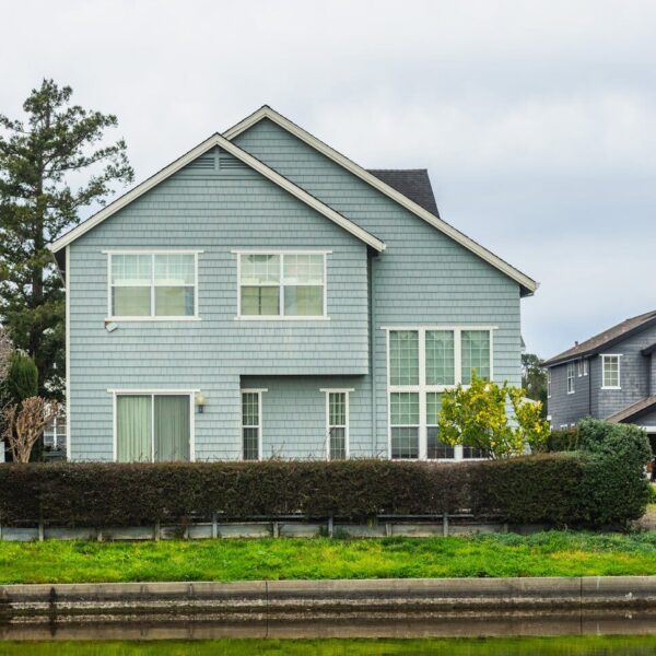 A contemporary detached house in a suburban neighborhood with a scenic canal front.