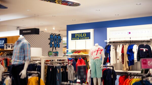 Vibrant clothing display at a modern retail store with mannequins featuring popular fashion brands.
