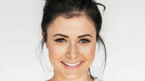 woman in white crew neck shirt smiling