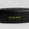 Sleek and luxurious black eyeglass case featuring the elegant Versace logo.