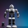 Close-up shot of two white robots displayed on a colorful gradient background symbolizing innovation in robotics.