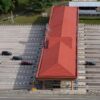 High angle aerial shot of a toll plaza with cars and trucks on an expansive highway.