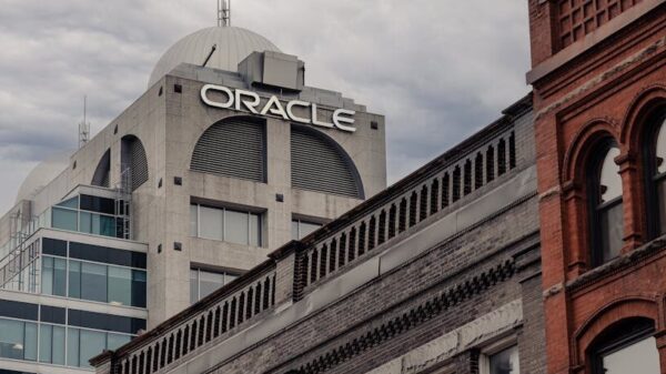 Cityscape with Oracle building in Kitchener, showcasing diverse architectural styles under an overcast sky.