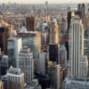 From above of downtown of megapolis with high rise financial and residential buildings located in New York City in daytime