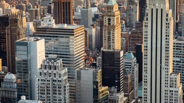 From above of downtown of megapolis with high rise financial and residential buildings located in New York City in daytime