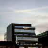 Contemporary architecture showcasing Amazon office at dusk in Iași, Romania.