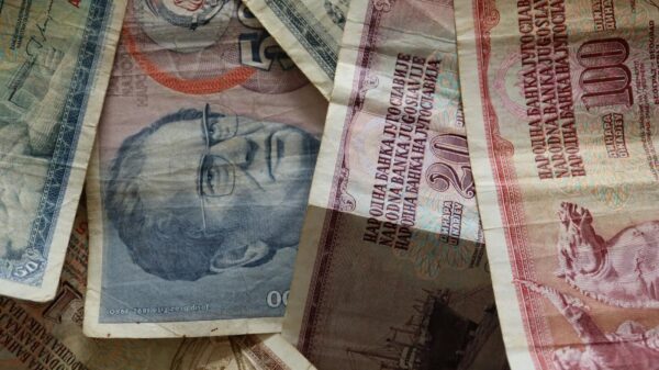 A close-up photo of diverse vintage banknotes, showcasing historical currency from different countries.