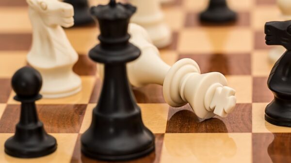 Close-up of chess pieces on a board depicting strategy and challenge.