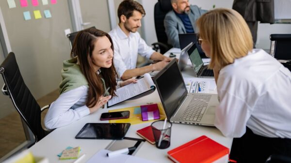 Team discussion in a modern office setting, focusing on cooperation and strategy development.