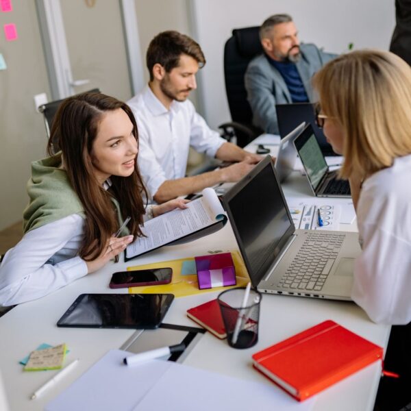 Team discussion in a modern office setting, focusing on cooperation and strategy development.