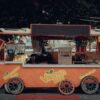 An inviting orange juice bar cart, perfect for urban street vibes.