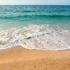 seashore under clear blue sky during daytime