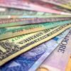 A close-up view of various international banknotes showcasing diverse currencies.