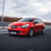 Dynamic shot of a red Renault Clio driving on a highway in Ankara, Türkiye.