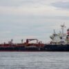 An oil tanker sailing on the open sea, ideal for maritime and logistics concepts.