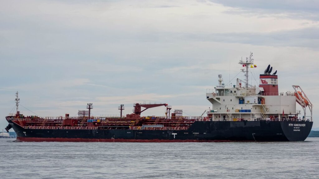 An oil tanker sailing on the open sea, ideal for maritime and logistics concepts.