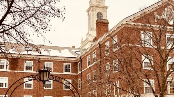 Historic brick building under a snowy sky with winter architecture charm.