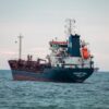 A large oil tanker named Agartha navigates through the open sea, capturing maritime transport.