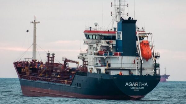 A large oil tanker named Agartha navigates through the open sea, capturing maritime transport.