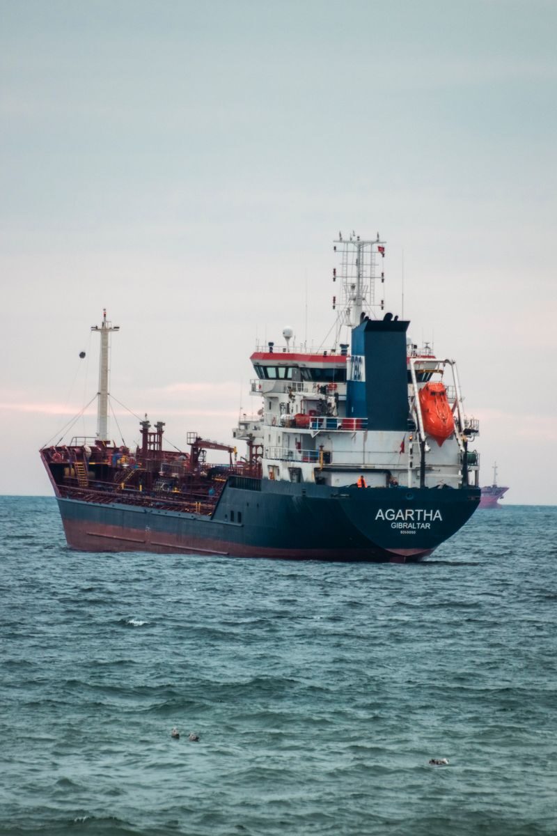 A large oil tanker named Agartha navigates through the open sea, capturing maritime transport.