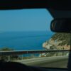 Enjoy a serene coastal road drive in Muğla, Türkiye with expansive ocean views.