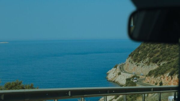Enjoy a serene coastal road drive in Muğla, Türkiye with expansive ocean views.