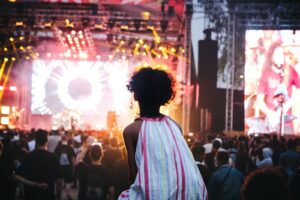 Vibrant outdoor music festival in Casablanca, Morocco with a lively crowd and colorful stage lights.