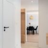Bright and airy modern apartment interior with minimalist design elements and natural light.