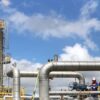 Modern gas plant operations with engineers in Lampung, Indonesia.