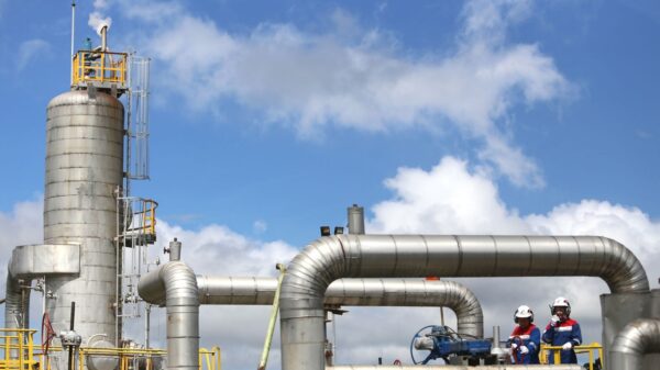 Modern gas plant operations with engineers in Lampung, Indonesia.