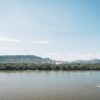 A serene view of the Danube River with a distant panorama of Budapest, Hungary.