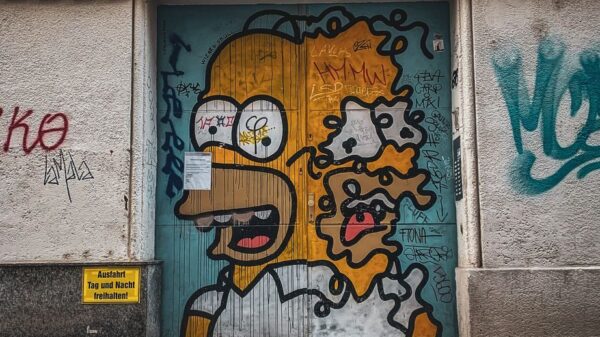 Street art of a popular cartoon character on a Viennese building door, showcasing urban creativity.